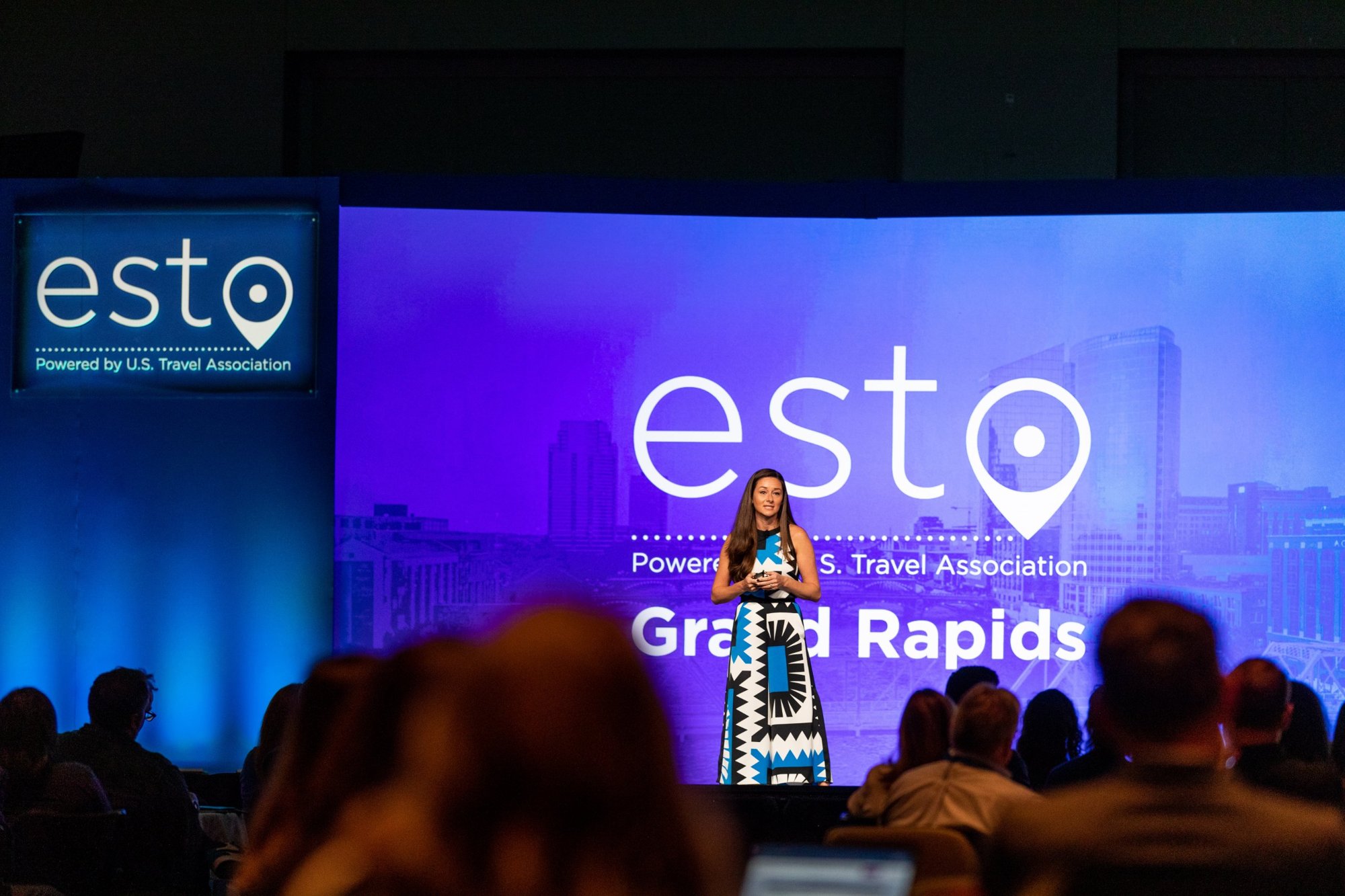 Danielle Posa speaking on stage at ESTO in Grand Rapids