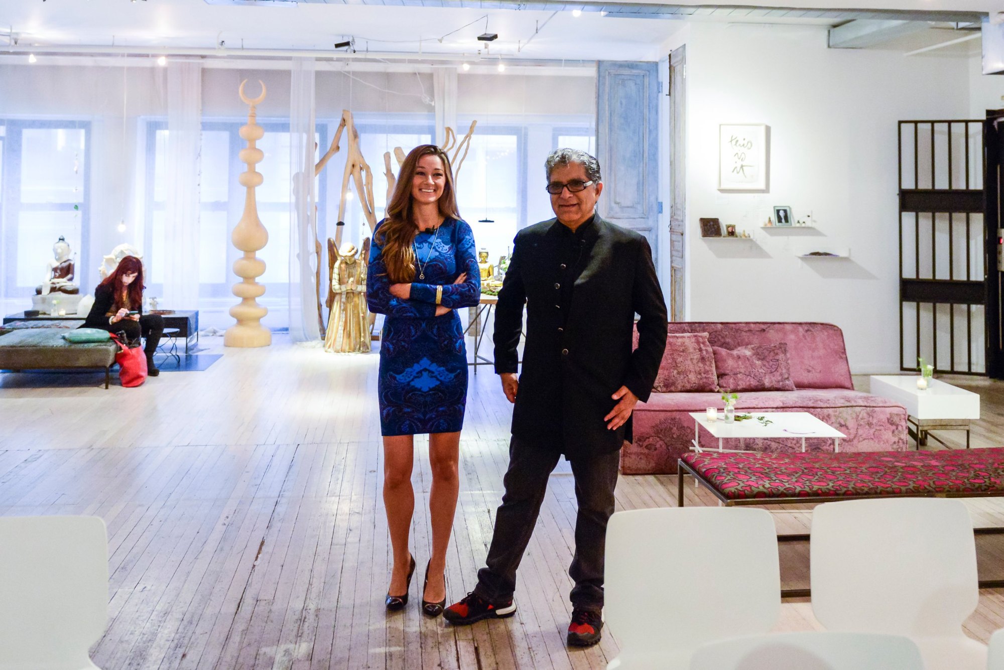 Danielle Posa standing beside Dr. Deepak Chopra at one of their speaking engagements